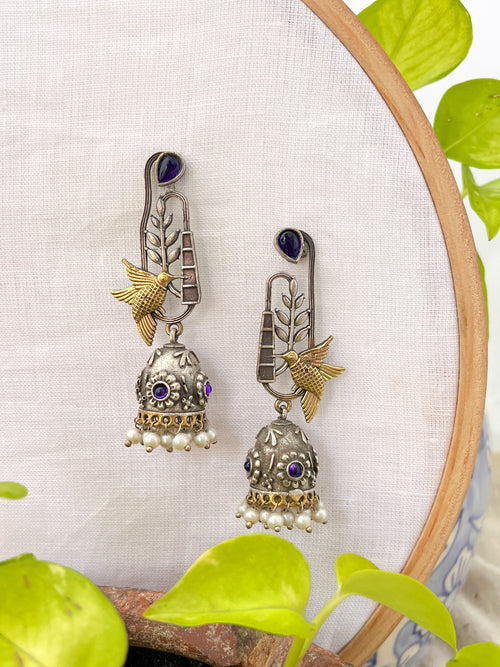 Pakhi- Dual Tone Bird Charm Oxidised Jhumka with Blue Stones & Pearl Drops